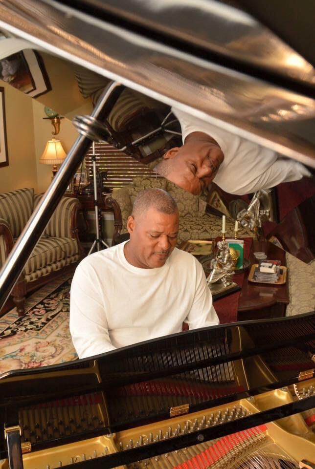 Shawn Brown playing a grand piano